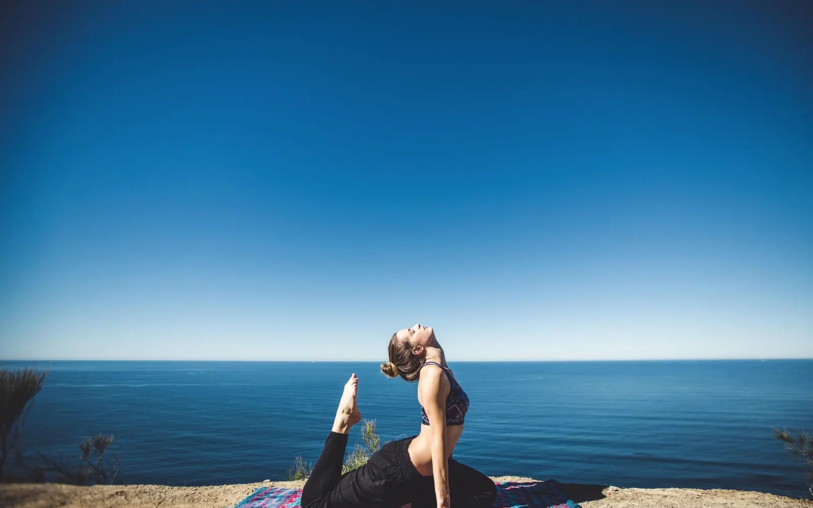 Woman, yoga and coast